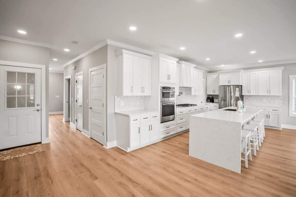Modern kitchen with open concept dining and living room