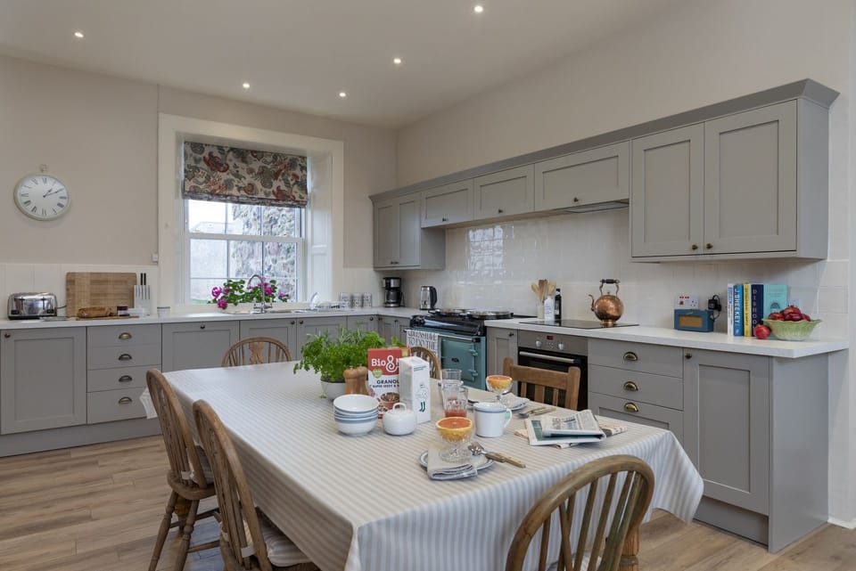 New Ladykirk Farmhouse - the open-plan farmhouse kitchen with an AGA and dining table