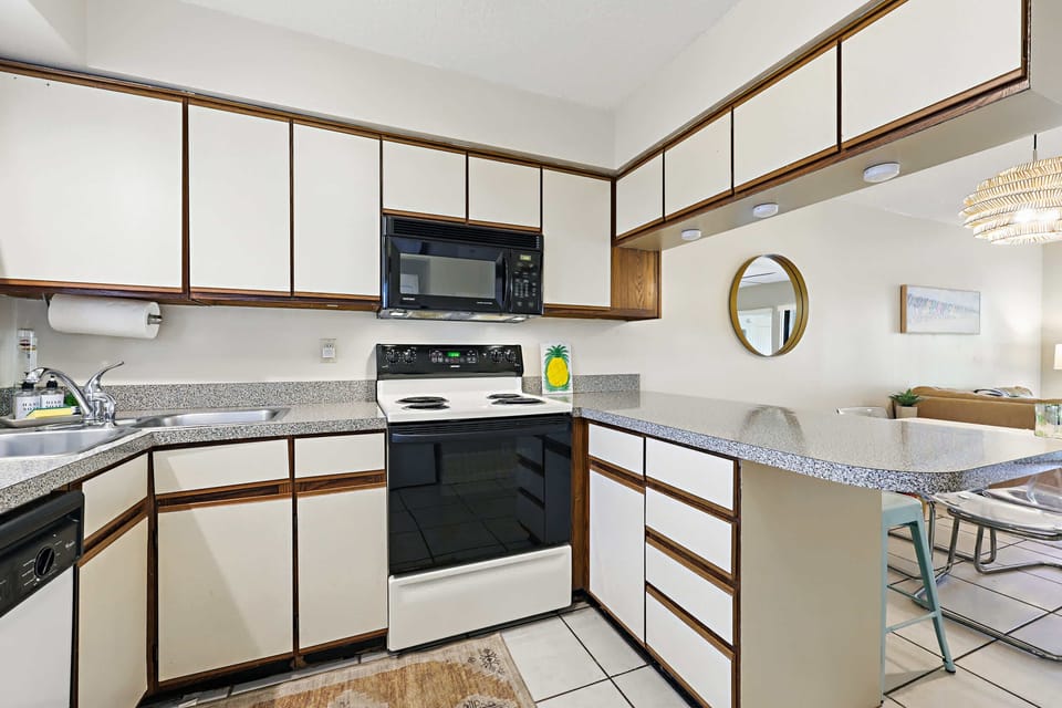 The open, airy kitchen offers ample space & every home comfort