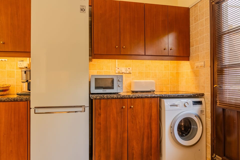Large open kitchen with high ceilings, equipped with washing machine, dishwasher, microwave, oven, fridge, stove, toaster (big enough for local pita bread!), citrus juicer, coffee machine, Nespresso machine, water boiler, blender, panini/haloumi grill, etc