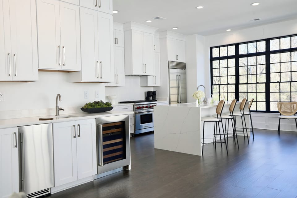 Bar Area with Beverage Refrigerator and ice maker.