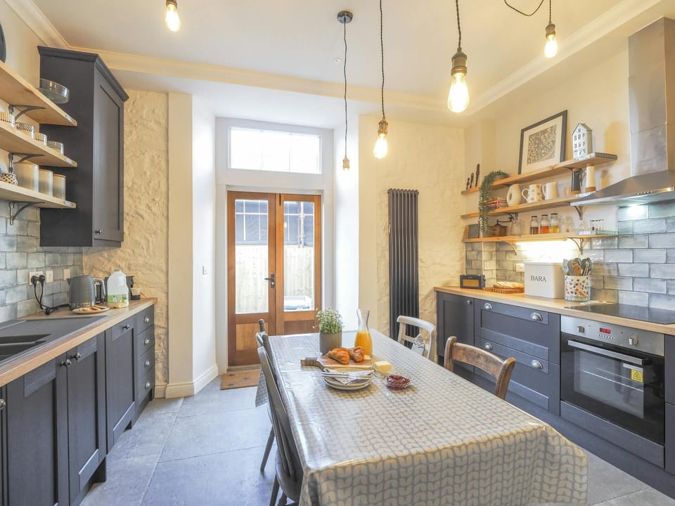 kitchen with matching appliances and integrated cooker.