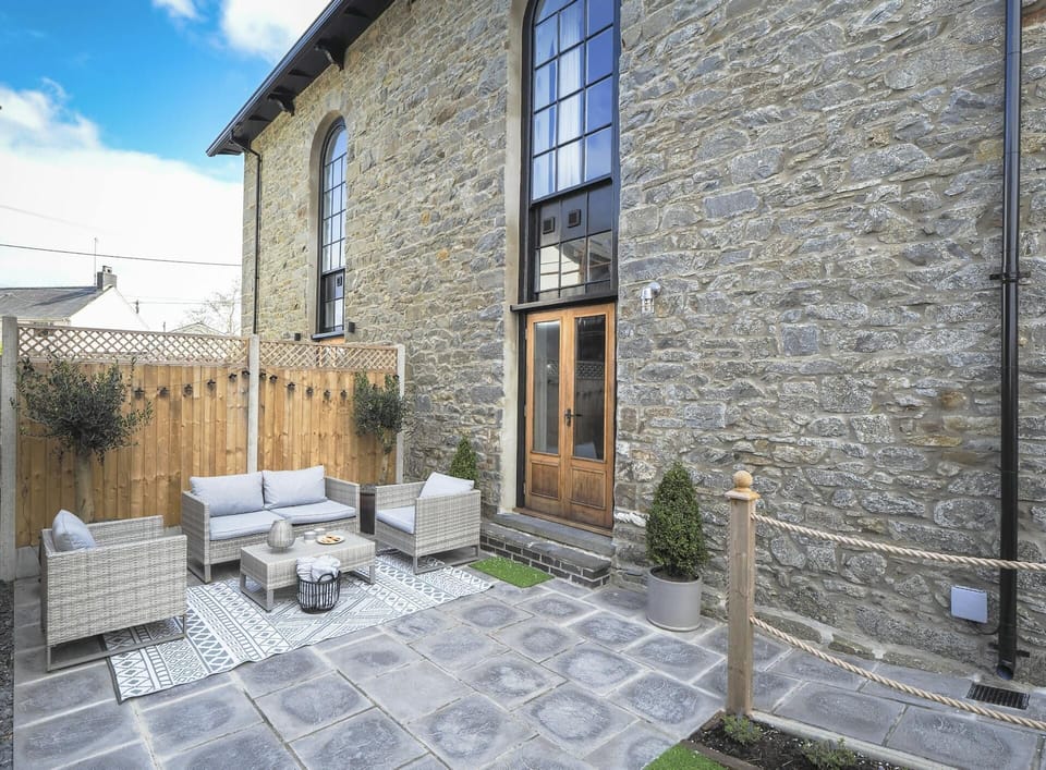 Garden with paving slabs and outside furniture