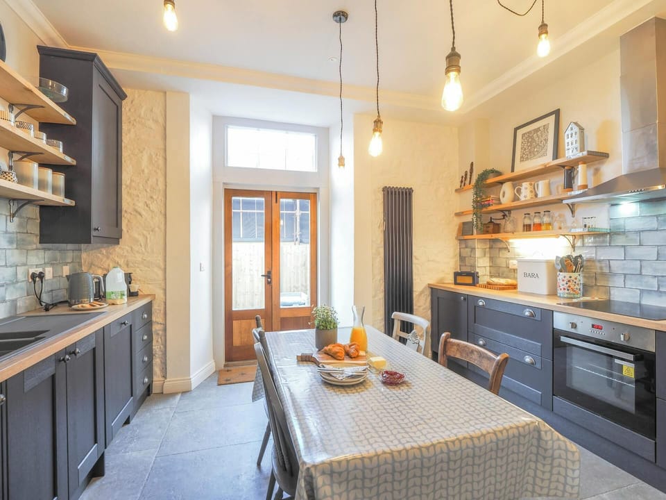 kitchen with matching appliances and integrated cooker.