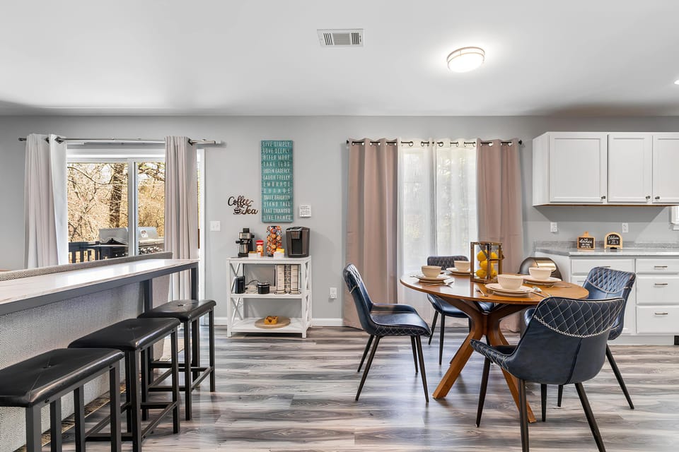 Modern full kitchen with a convenient counter bar and stylish stools — perfect for cooking and casual dining.