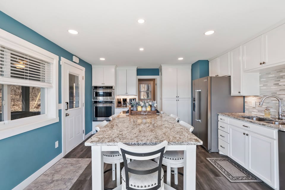 Seating for 6, spacious island and coffee bar completes this kitchen.
