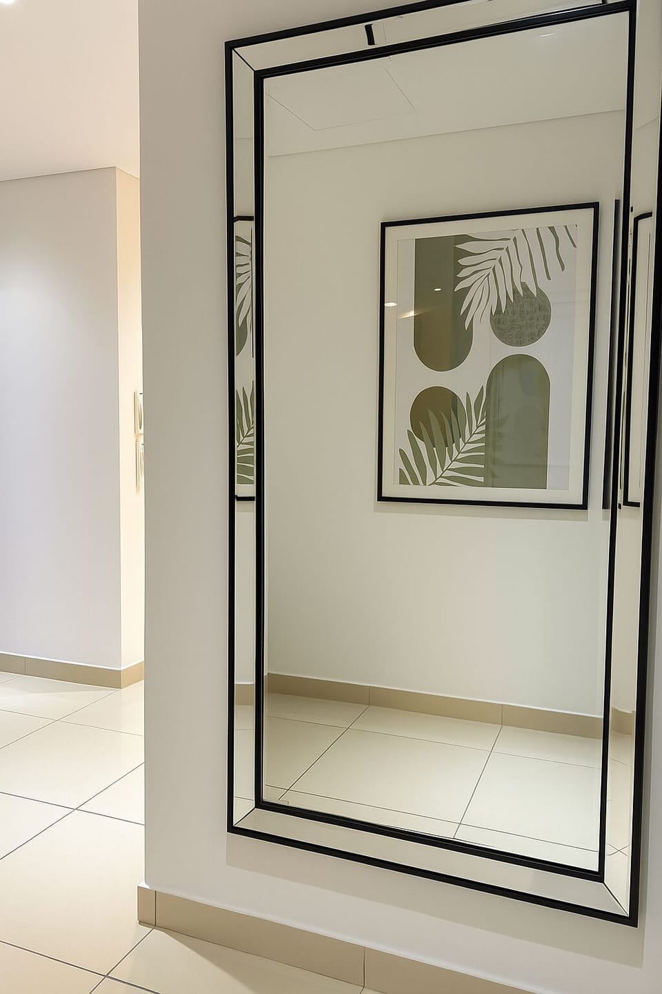 Entryway with large mirror