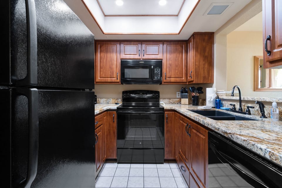 Kitchen with black appliances.