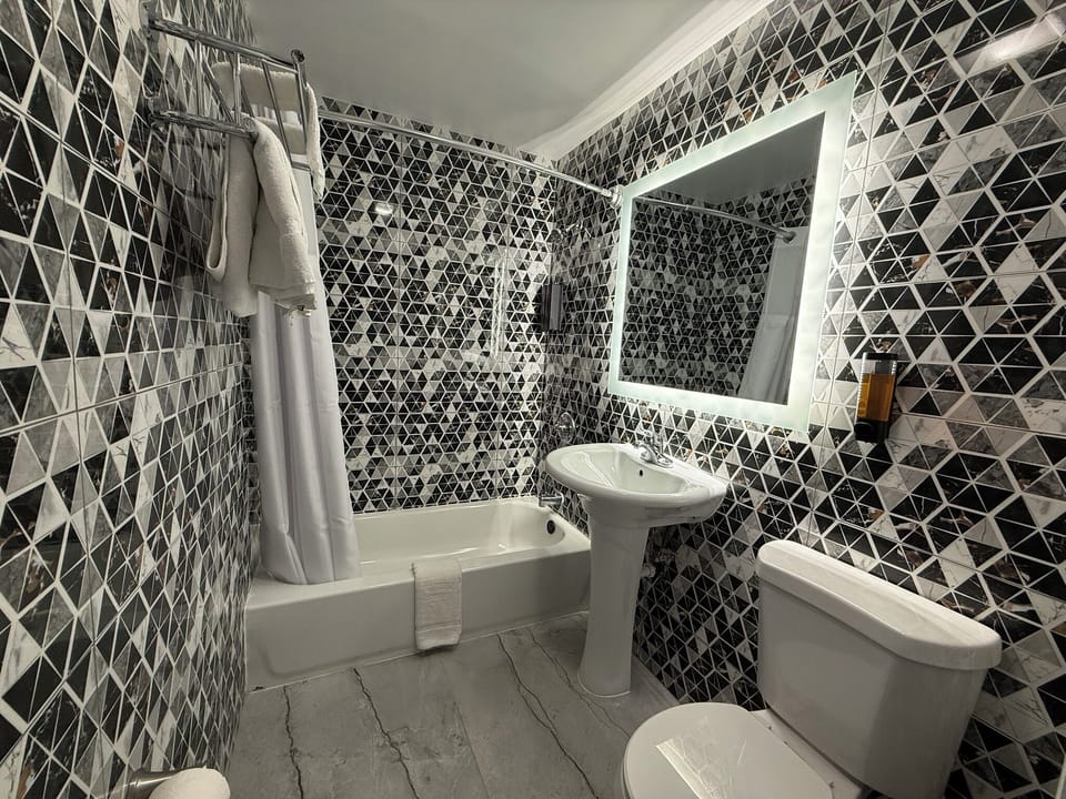 Bathtub, towels, soap, shampoo