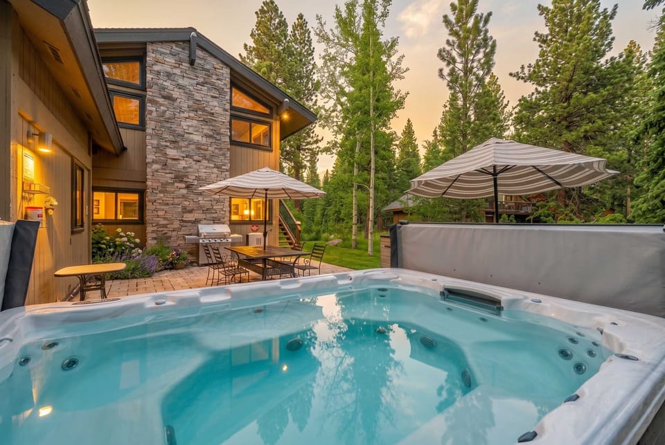 Hot tub: Private 10–12 person hot tub in backyard with patio access