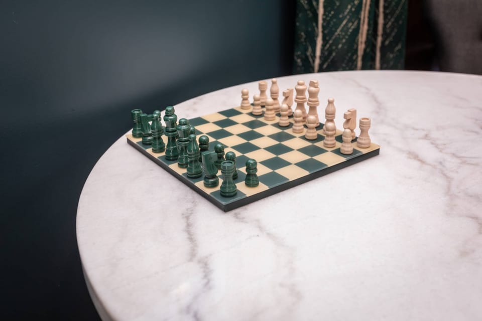 Chess set on a marble table ready for a strategic game