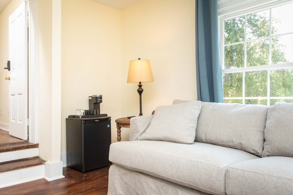 Cozy seating area with natural light and a coffee station for your convenience.