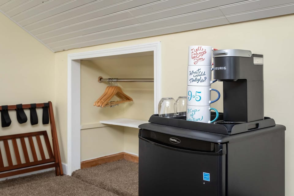 Compact coffee station with a Keurig machine and mugs for a convenient start to your day.