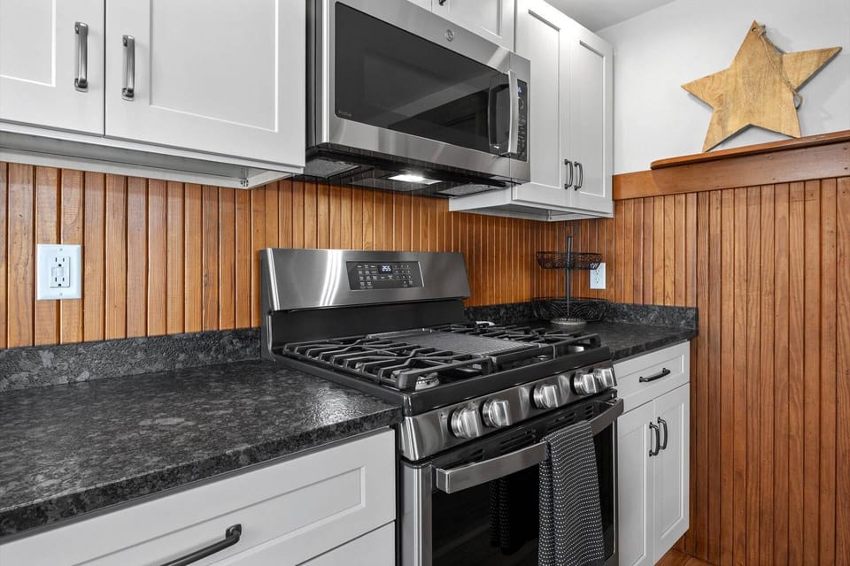 Another view of the stove, oven, and microwave