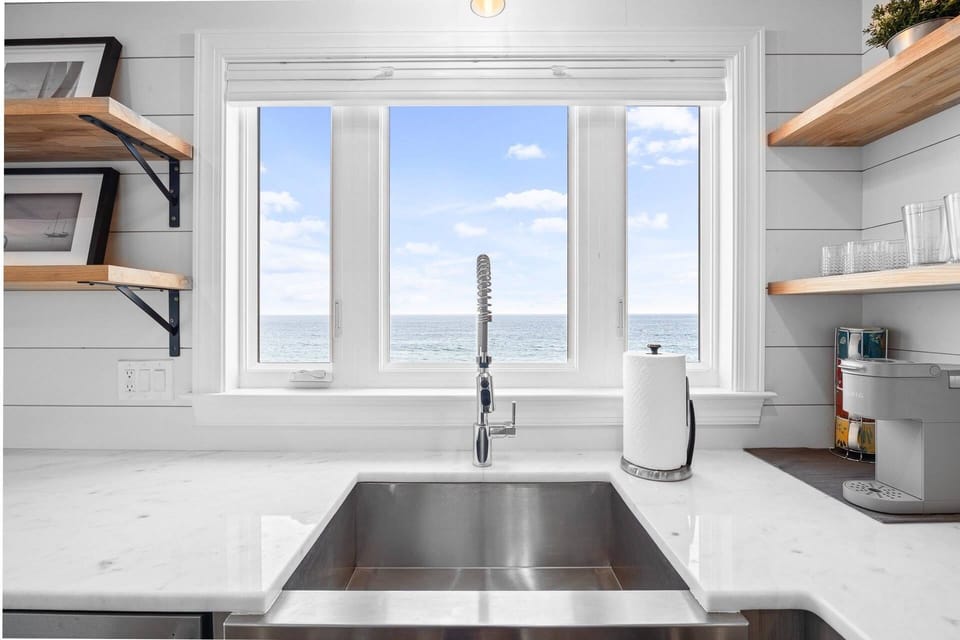 Kitchen sink and Keurig coffee maker with ocean views right out the window