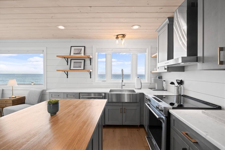 Another view of the kitchen with gorgeous ocean vista from the windows