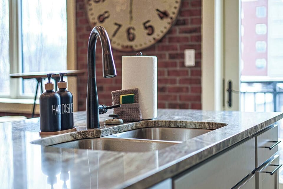 Kitchen: Stylish space with sleek fixtures and a view—perfect for culinary adventures!
