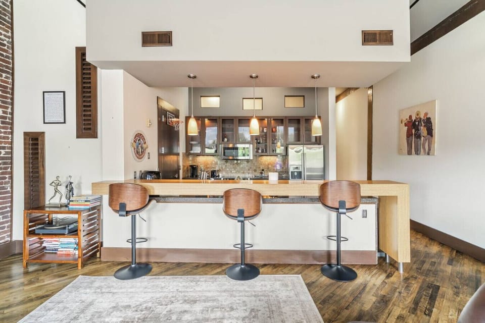 Kitchen Bar: Modern design with sleek stools and stylish lighting for the ultimate hangout spot!