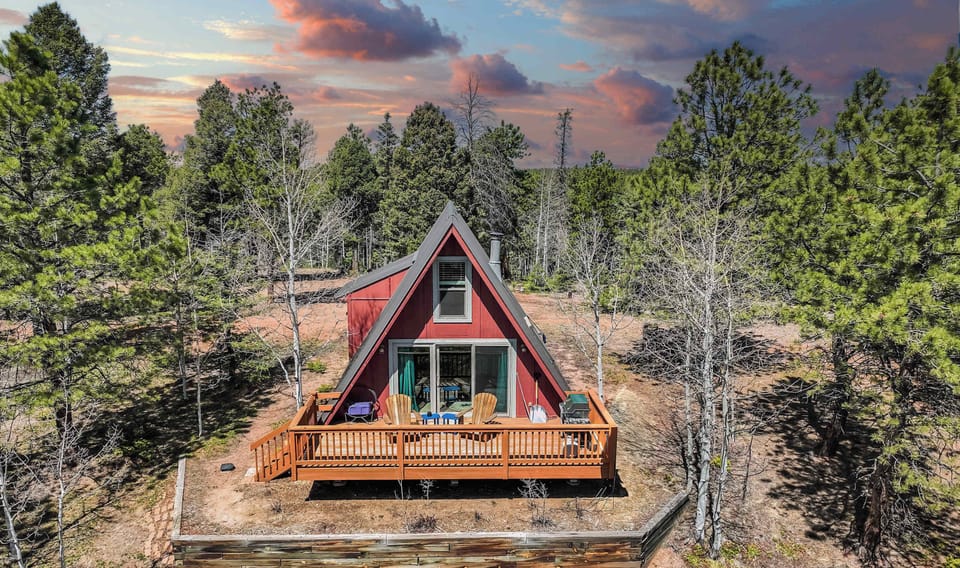 Welcome to Sloped Summit! Nestled among the pines in Divide, this charming A-frame cabin offers a peaceful mountain escape with a spacious deck and scenic surroundings—perfect for soaking up the fresh alpine air.
