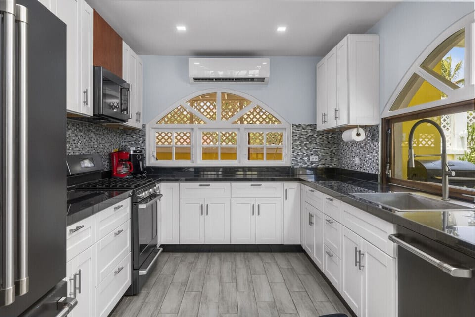 This is the kitchen in the main house, where style meets functionality for all your culinary adventures!