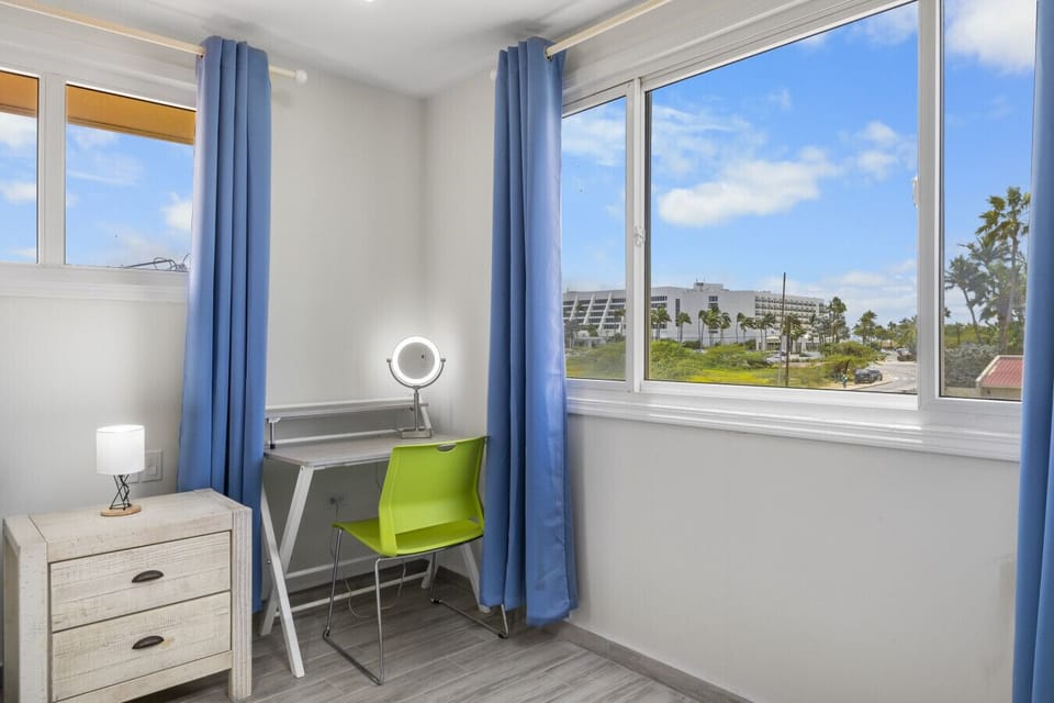 Master bedroom 1: Bright and inviting workspace with a view, perfect for productivity!