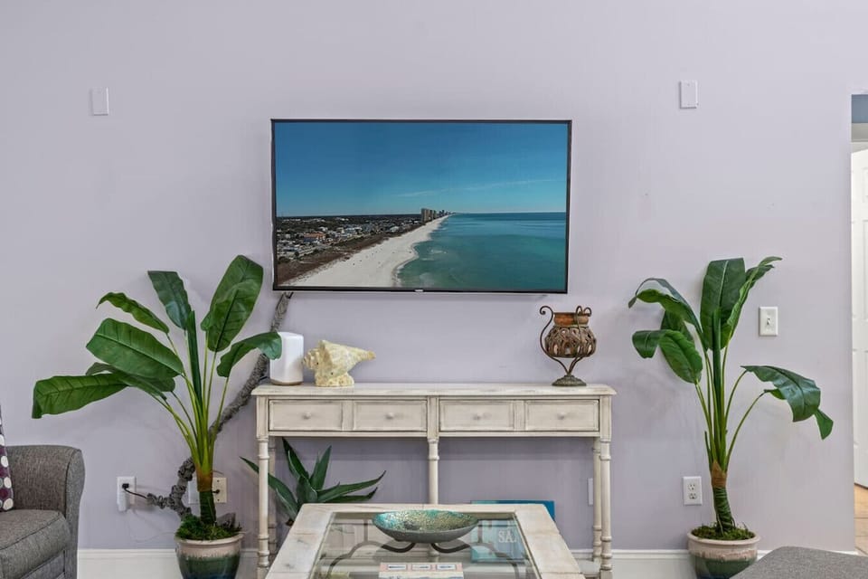 The smart TV in the living room is a perfect addition for both entertainment and convenience. With easy access to streaming services, apps, and the ability to connect with other smart devices, it provides endless entertainment options for movie nights, sp