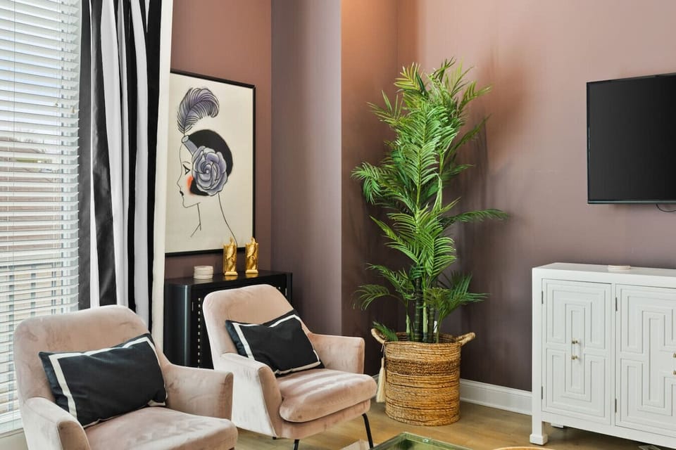 Sit back and relax in this spacious, inviting living room with a comfortable sofa bed, plenty of seating, a Juliet balcony, and a Smart TV with all the streaming services available to you. Thoughtful details and furnishings throughout our space to make yo