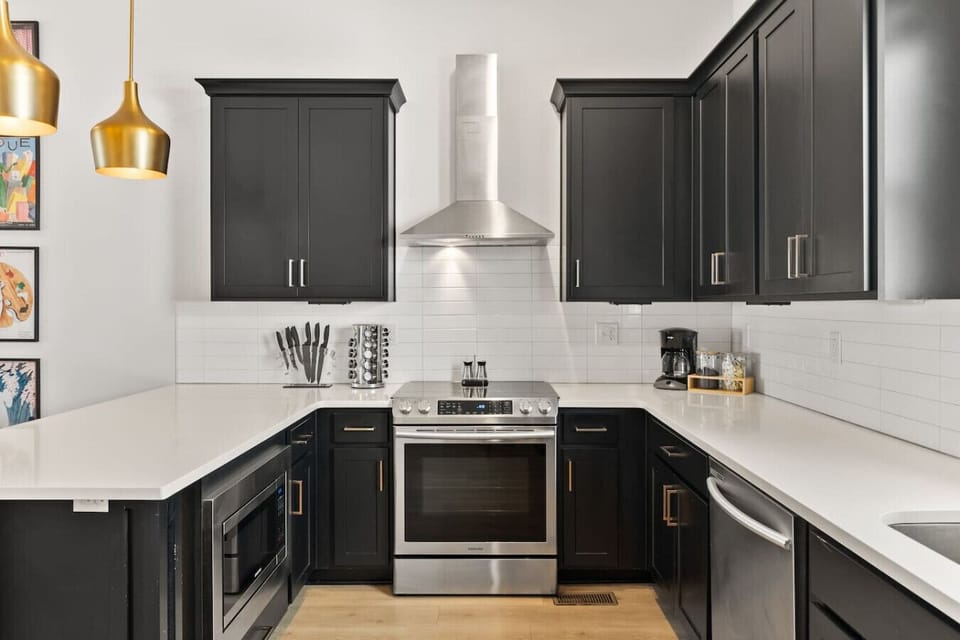 Fully-equipped kitchen with stainless steel appliances, a coffee maker + grounds provided, and all the dishware + utensils you might need to cook and enjoy a meal at home.