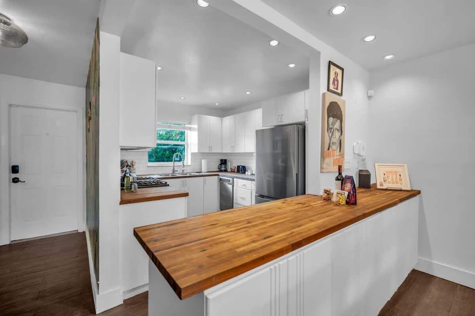 A fully equipped, open-concept kitchen that effortlessly blends style and function — the ideal space to elevate your Miami getaway.