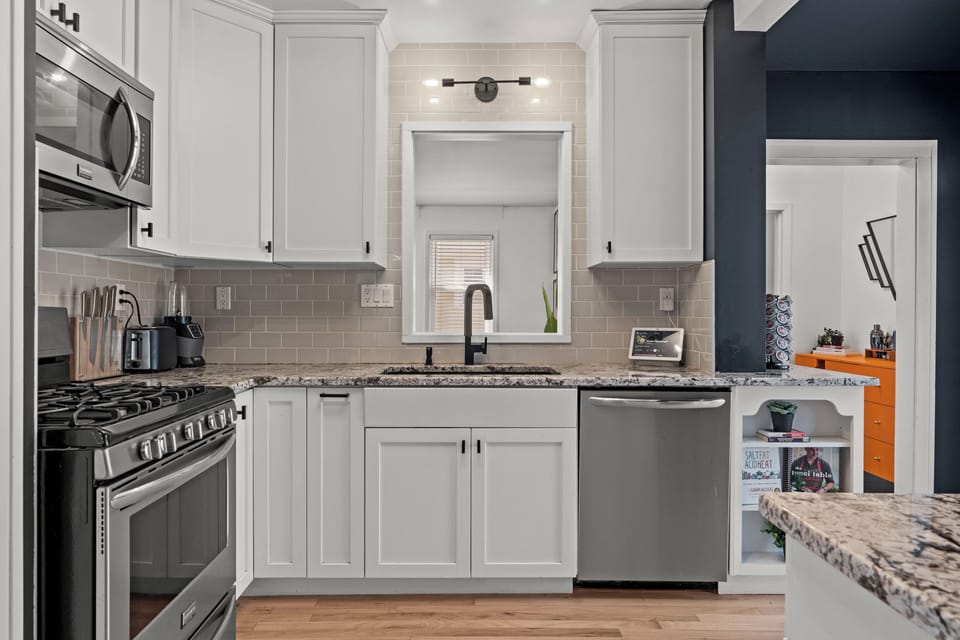Updated full kitchen with stainless steel appliances, granite countertops, and everything needed for cooking at home