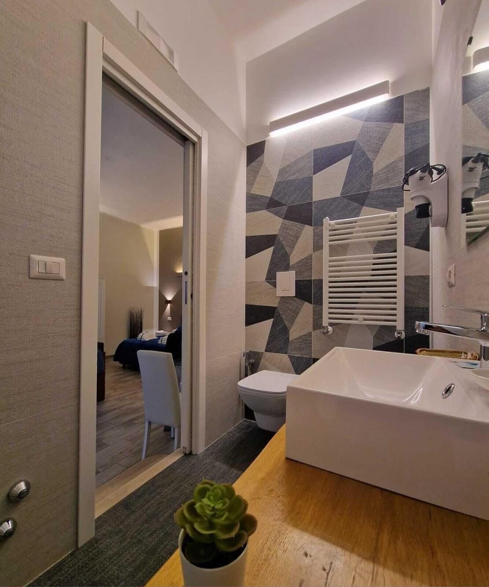 Deluxe Quadruple Room, Balcony | Laptop workspace, iron/ironing board, free WiFi, bed sheets