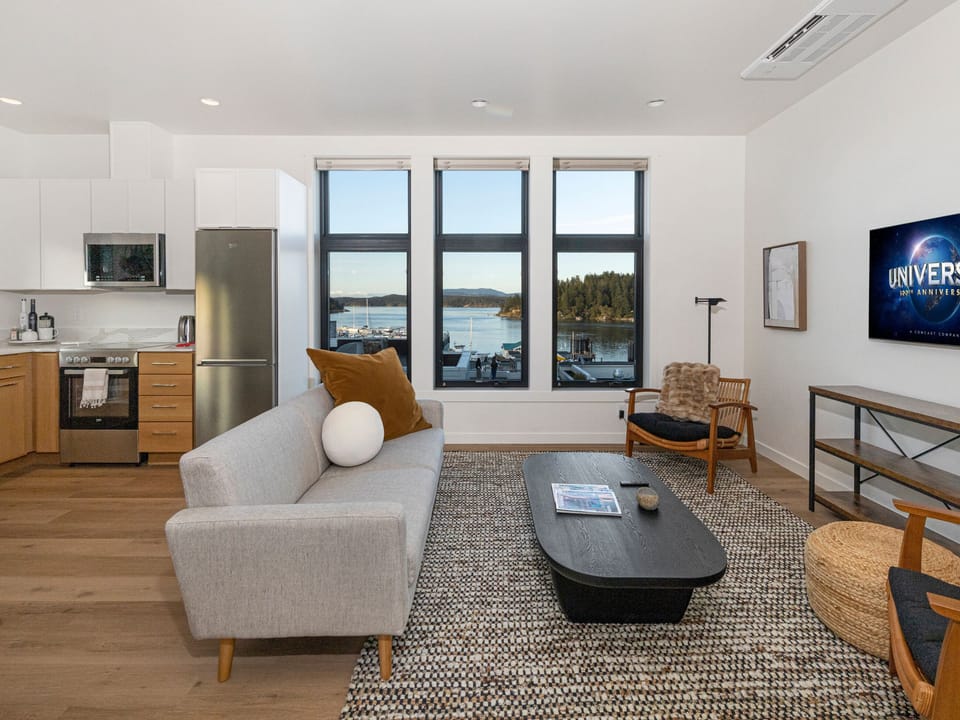 Enjoy third floor, unobstructed expansive views of the harbor from this luxurious penthouse located in charming downtown Friday Harbor.