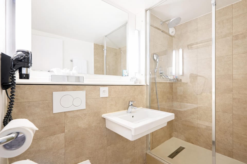 Shower, rainfall showerhead, eco-friendly toiletries, hair dryer