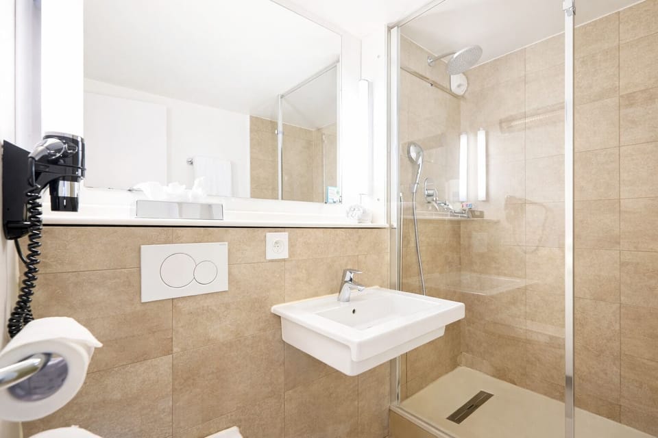 Shower, rainfall showerhead, eco-friendly toiletries, hair dryer