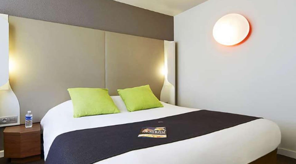 Premium bedding, desk, laptop workspace, blackout drapes