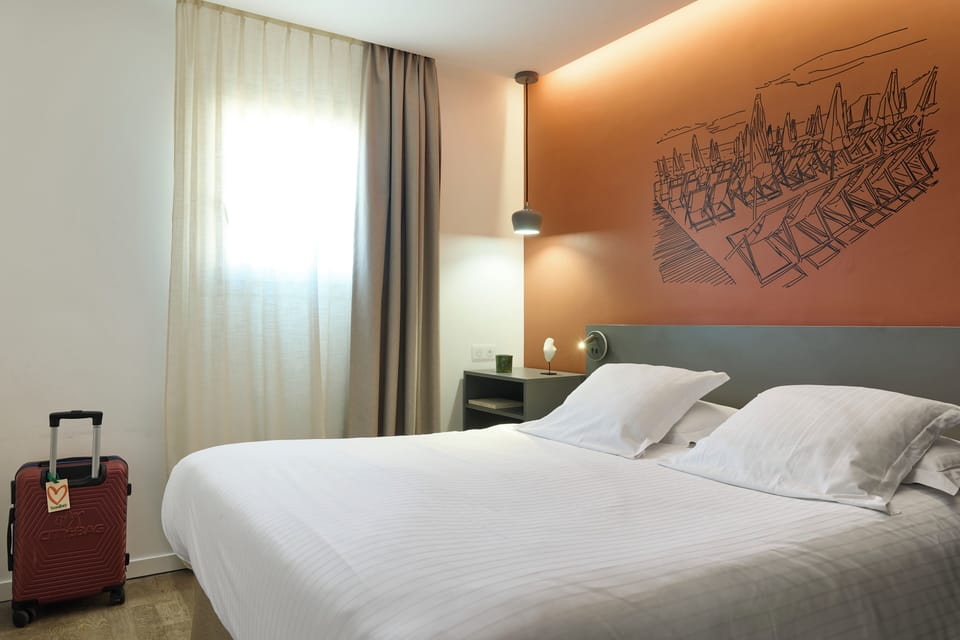 Comfort Room | Desk, laptop workspace, blackout drapes, soundproofing