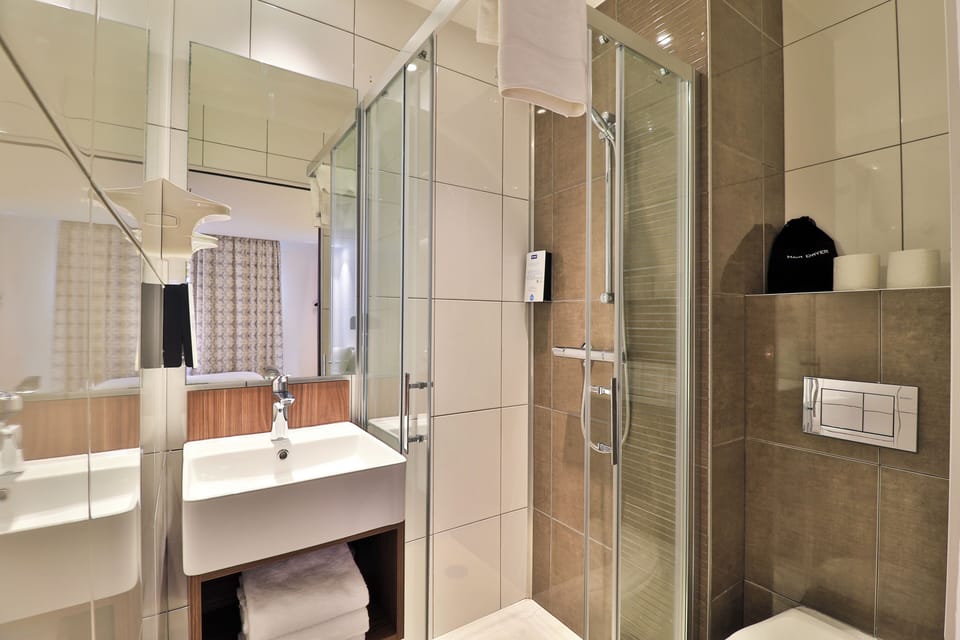 Shower, eco-friendly toiletries, hair dryer, towels