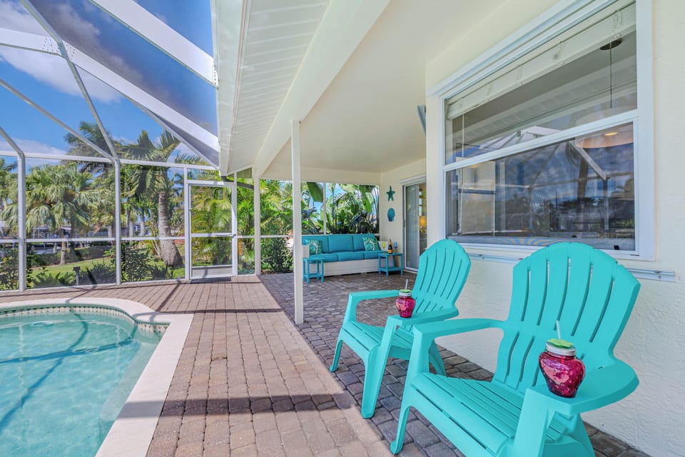 - Sip coffee or cocktails in these inviting turquoise loungers just steps from the pool
- Covered patio provides cool shade and tropical views in every direction
- Perfect spot to start or end your day by the water’s edge