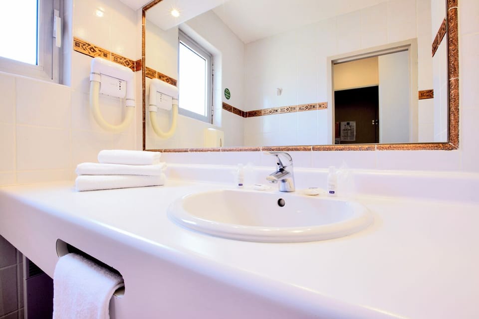 Eco-friendly toiletries, hair dryer, towels