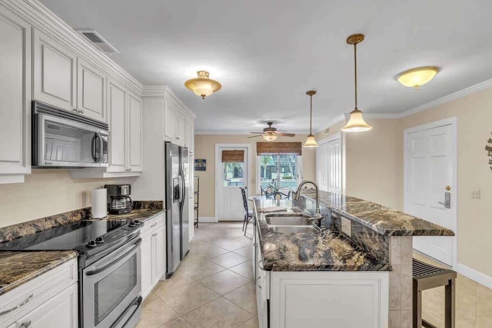 Modern kitchen with granite countertops and stainless steel appliances