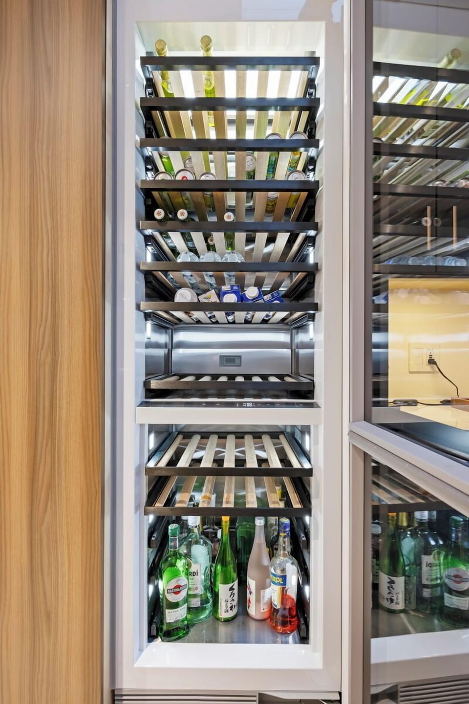 Chill your favorite vintages in this fully stocked wine fridge—perfect for toasting lakeside sunsets.