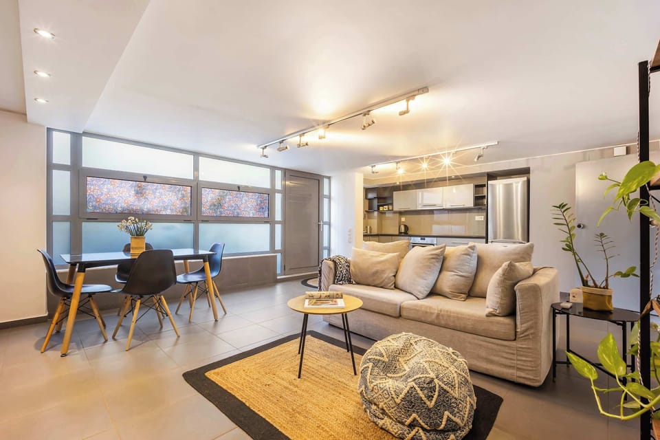 Sunlit living and dining area creating a stylish, comfortable hub in vibrant central Gkazi.