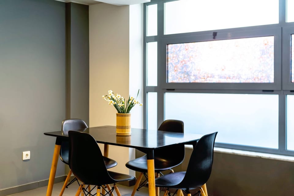 Intimate dining setting with soft natural light, creating a warm atmosphere for shared moments.