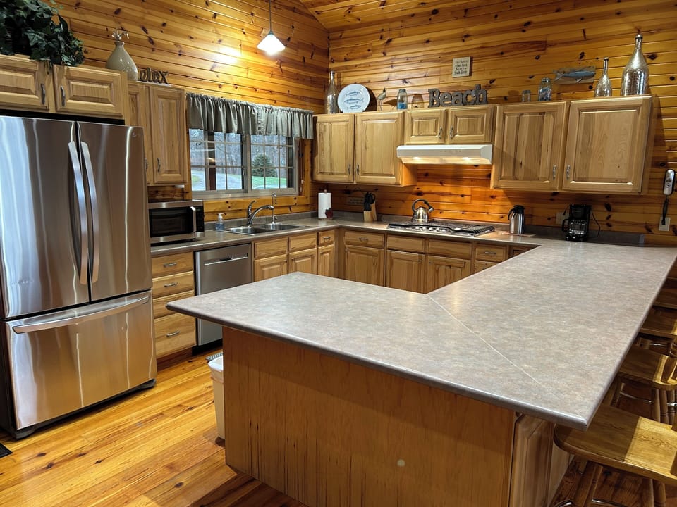 Kitchen with under-counter electric oven.
