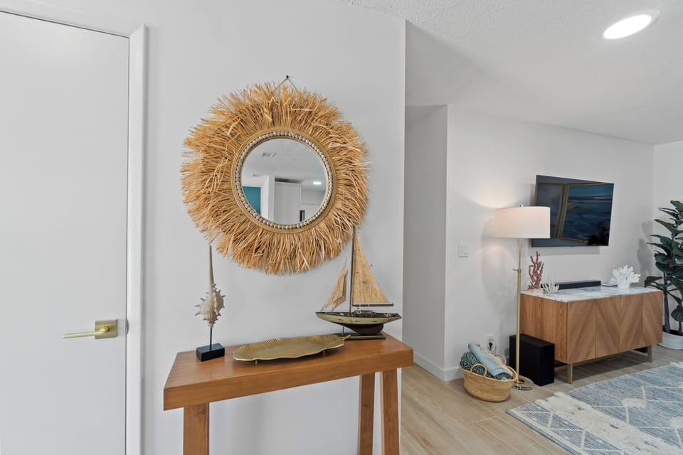 Step into your stylish coastal retreat where warm wood tones and nautical touches create the perfect atmosphere for relaxation.
