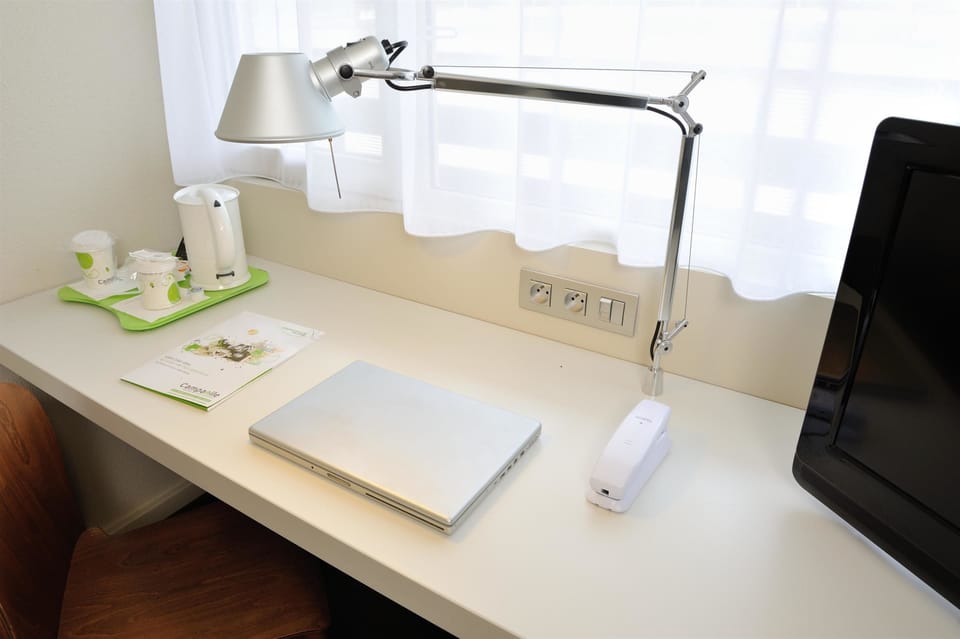Desk, laptop workspace, blackout drapes, soundproofing