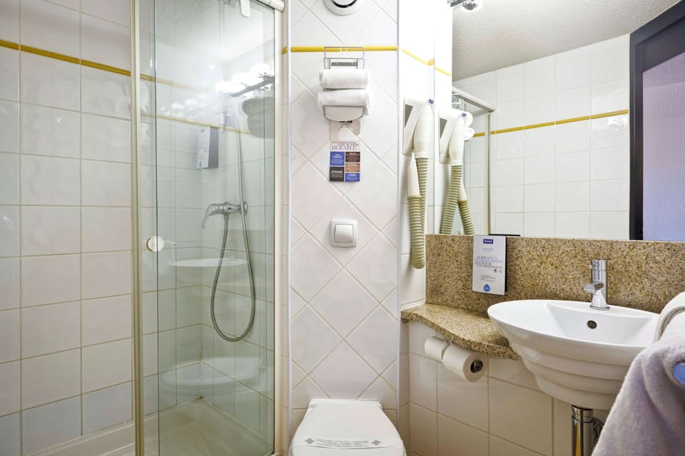 Eco-friendly toiletries, hair dryer, towels