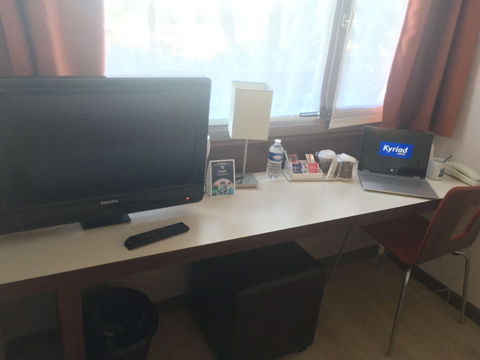Desk, laptop workspace, blackout drapes, free cribs/infant beds