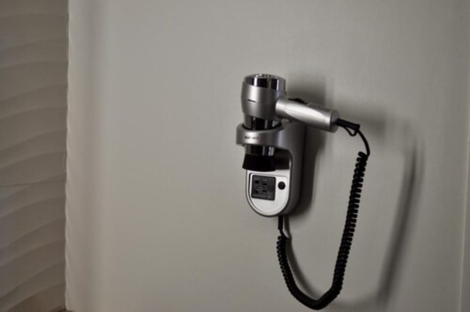 Bathtub, eco-friendly toiletries, hair dryer, towels