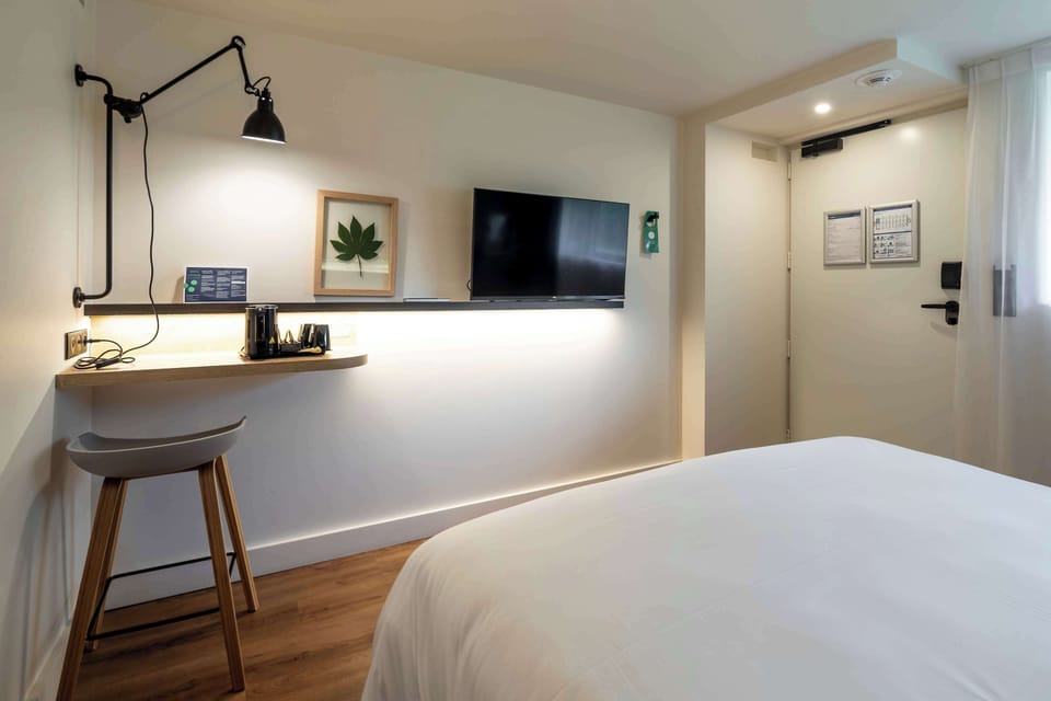 Premium bedding, desk, laptop workspace, blackout drapes